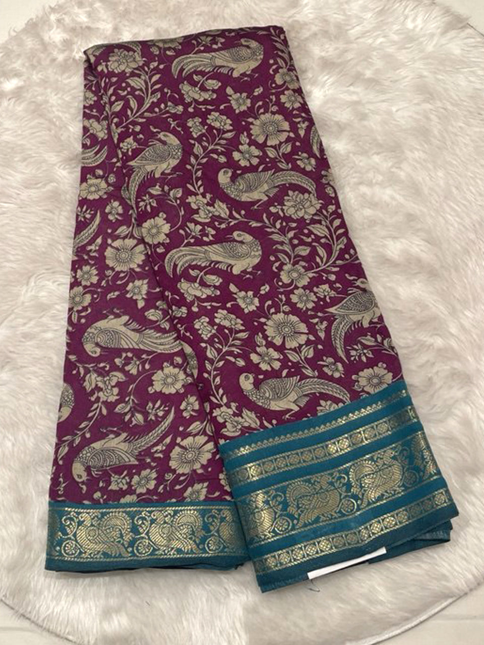 Beige Chhagal silk saree featuring intricate Kalamkari vine patterns and a bottle green contrast gold zari border.