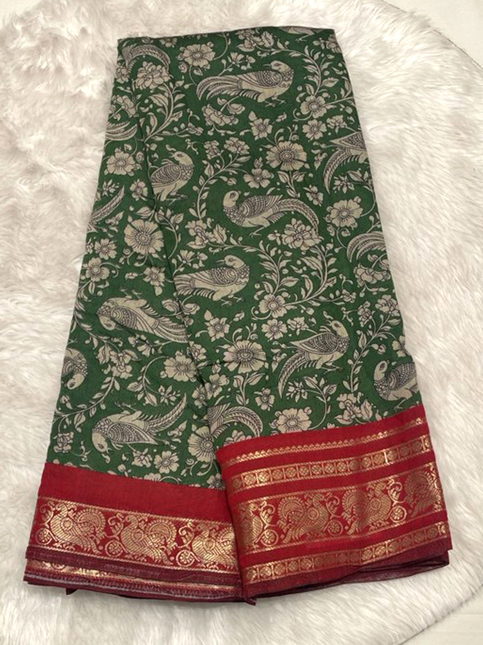 Mustard yellow Chhagal silk saree with traditional Kalamkari art and a navy blue contrast gold zari border.