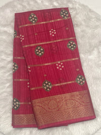 Magenta pink Bailu jute silk saree with gold zari weaving lines and traditional bandhani buta design.
