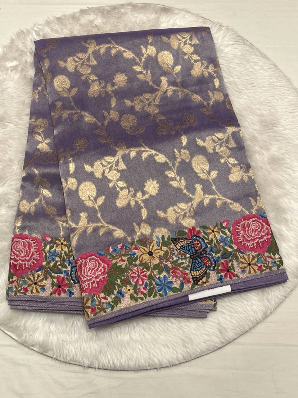 A cool-toned metallic purple base with gold floral weaving.