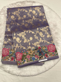 A cool-toned metallic purple base with gold floral weaving.