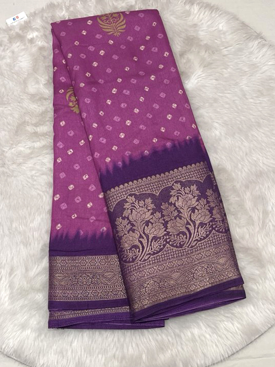 Magenta Banarasi fancy silk saree with small Bandhani prints and a deep royal purple contrast zari border.