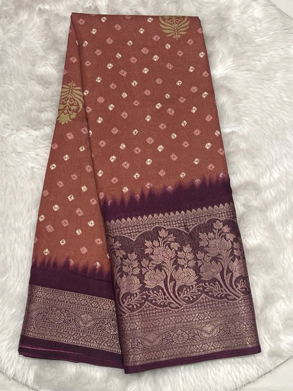 Magenta Banarasi fancy silk saree with small Bandhani prints and a deep royal purple contrast zari border.