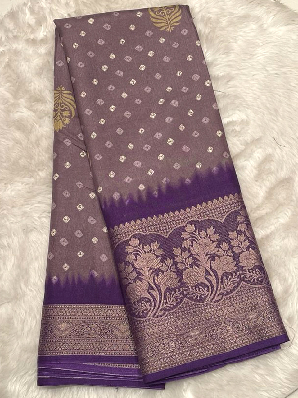 Lavender Banarasi fancy silk saree with a traditional Bandhani design and a rich wine-colored contrast floral border.
