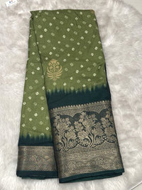 Olive green Banarasi fancy saree with a golden leaf motif and a dark forest green contrast zari border.