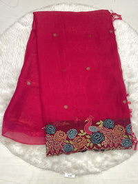 Red chiffon silk saree with small gold buttis and a heavy cutwork embroidery border with peacock motifs.