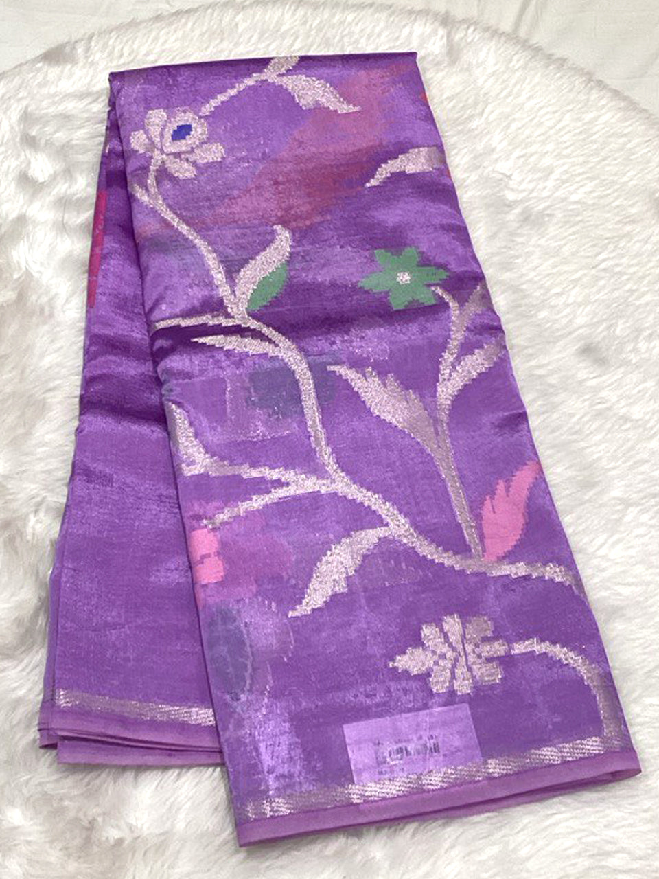 Elegant lavender Dola Silk saree with intricate double jacquard silver vine patterns.