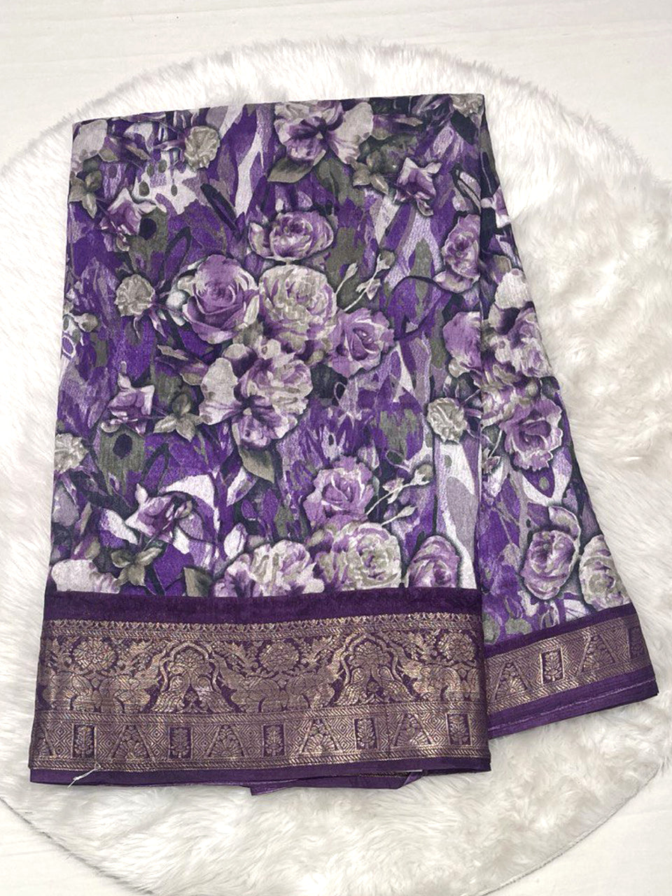 Deep purple crushed texture saree with vintage floral bloom print and intricate zari border.