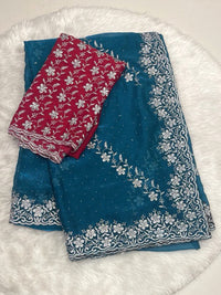 Teal Blue Chiffon Saree with Heavy Silver Zari Floral Cutwork Border and Vibrant Contrast Designer Blouse.