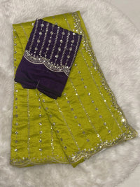 Lime green jute silk saree with sequin detailing and cutwork border, contrasting with a purple designer blouse.
