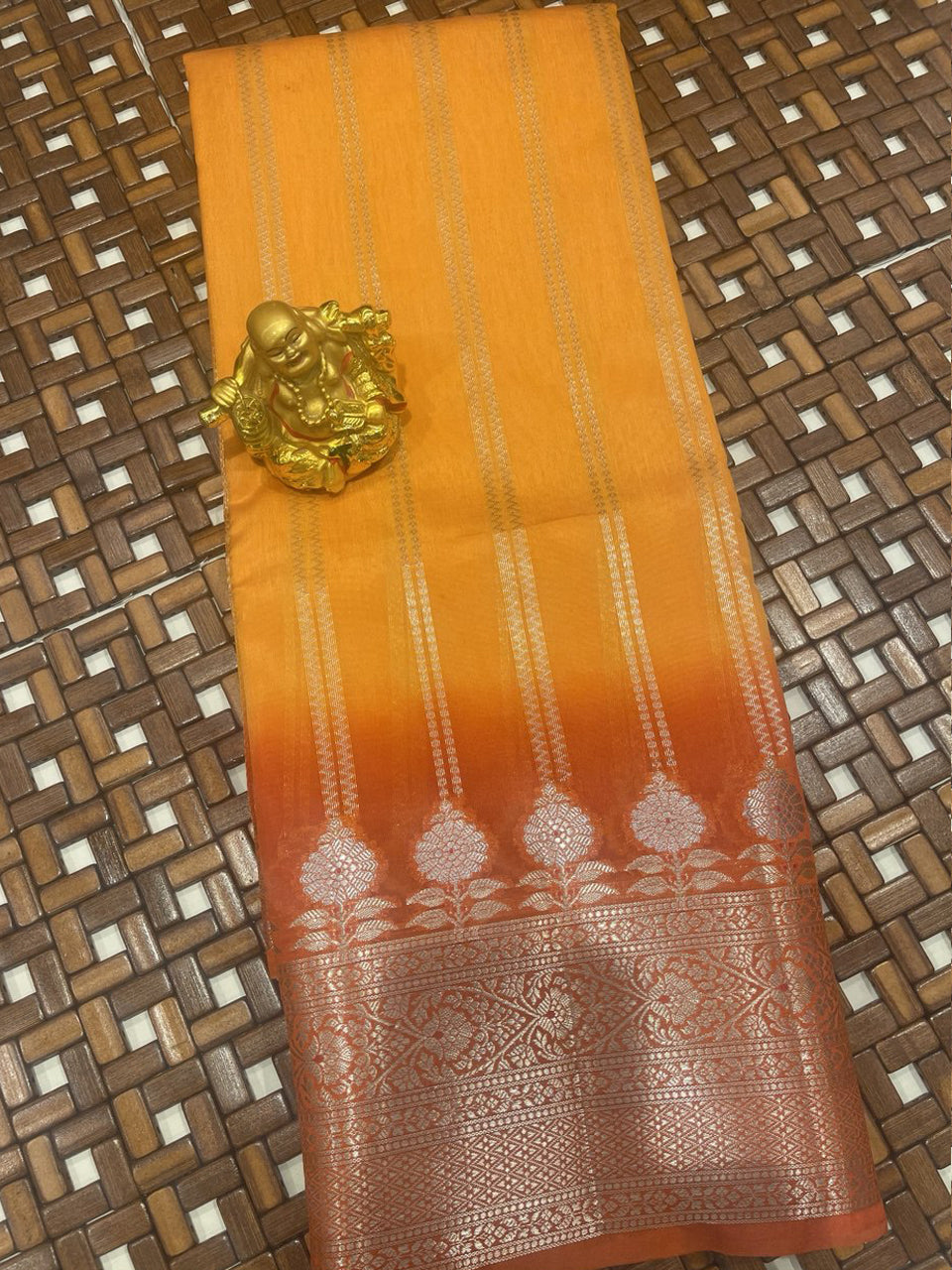 Orange Chiniya Fancy Saree featuring standing design lines and rich antique zari woven border.