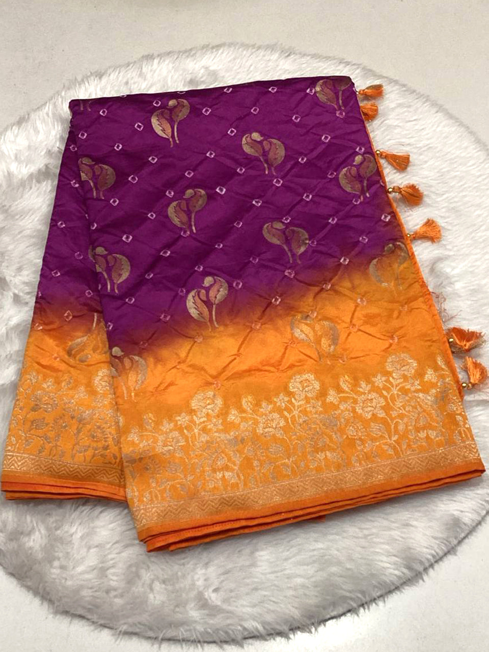 Purple and orange ombre shaded silk saree featuring traditional foil print and zari work.