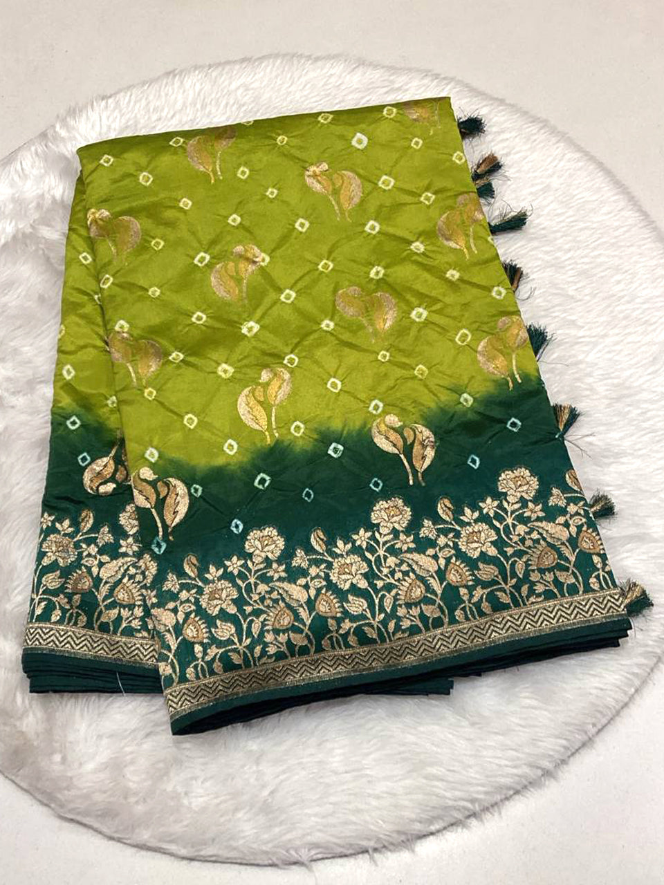 Lime green and dark green shaded Bandhani saree with intricate gold floral embroidery on the border.