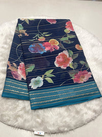 Navy Blue Micro Chiffon saree with floral print, zari lines, and teal contrast border.