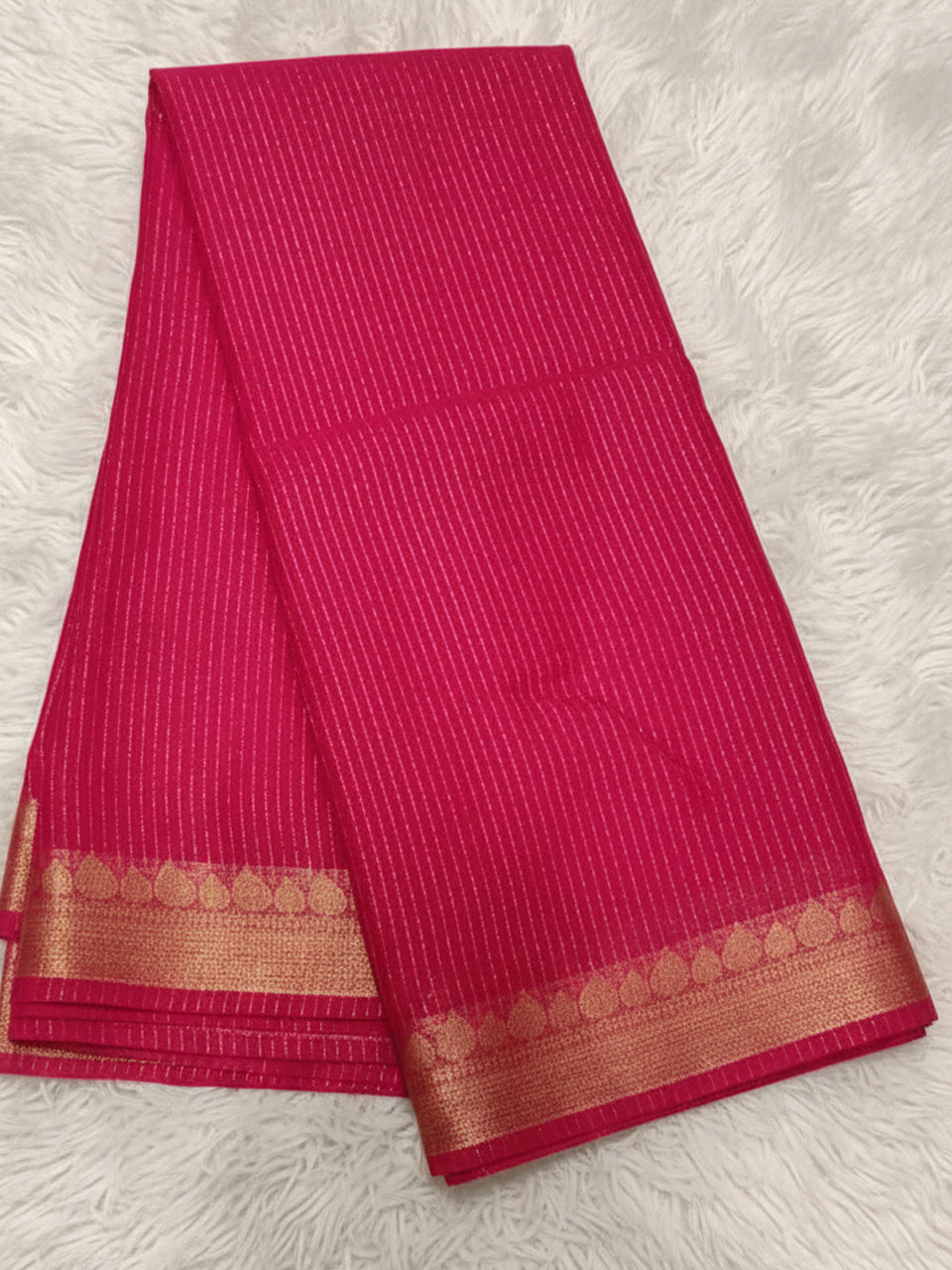 Rani pink millennium georgette saree with vertical zari stripes and gold leaf border