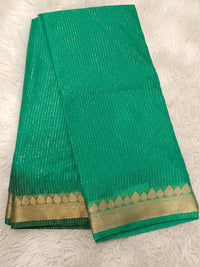 Emerald green millennium georgette saree for festive wear with zari leaf border