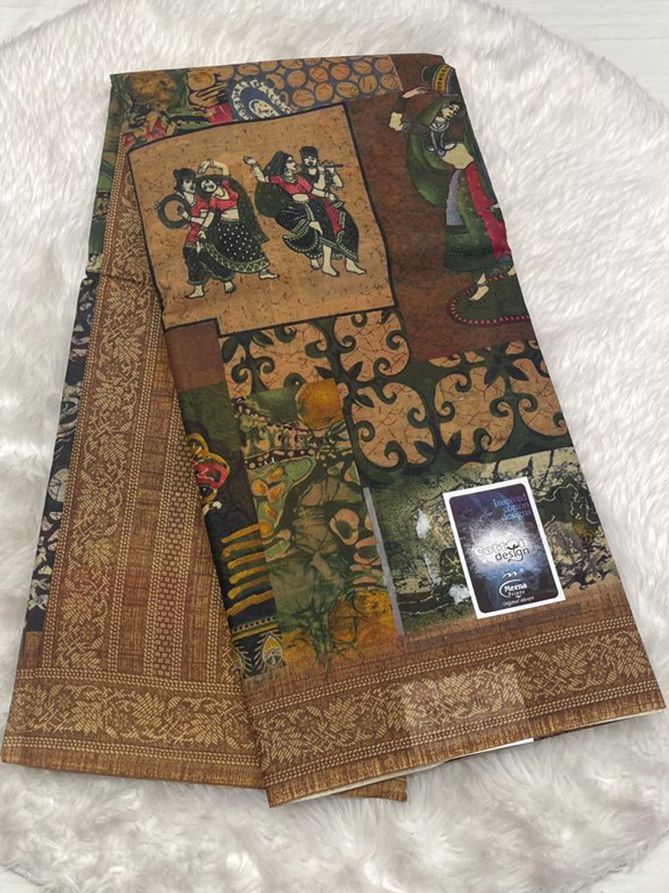Forest green and mustard Meena cotton saree with traditional Meena motifs and a broad floral border.