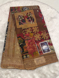 Neutral tan and brown Meena cotton saree with detailed patchwork folk-art illustrations.