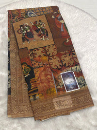 Brown Meena cotton saree with rustic terracotta hues and ethnic artwork.