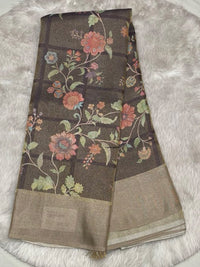 Deep plum-toned Muslin Tissue saree with large floral vine motifs and a shimmering solid gold border.
