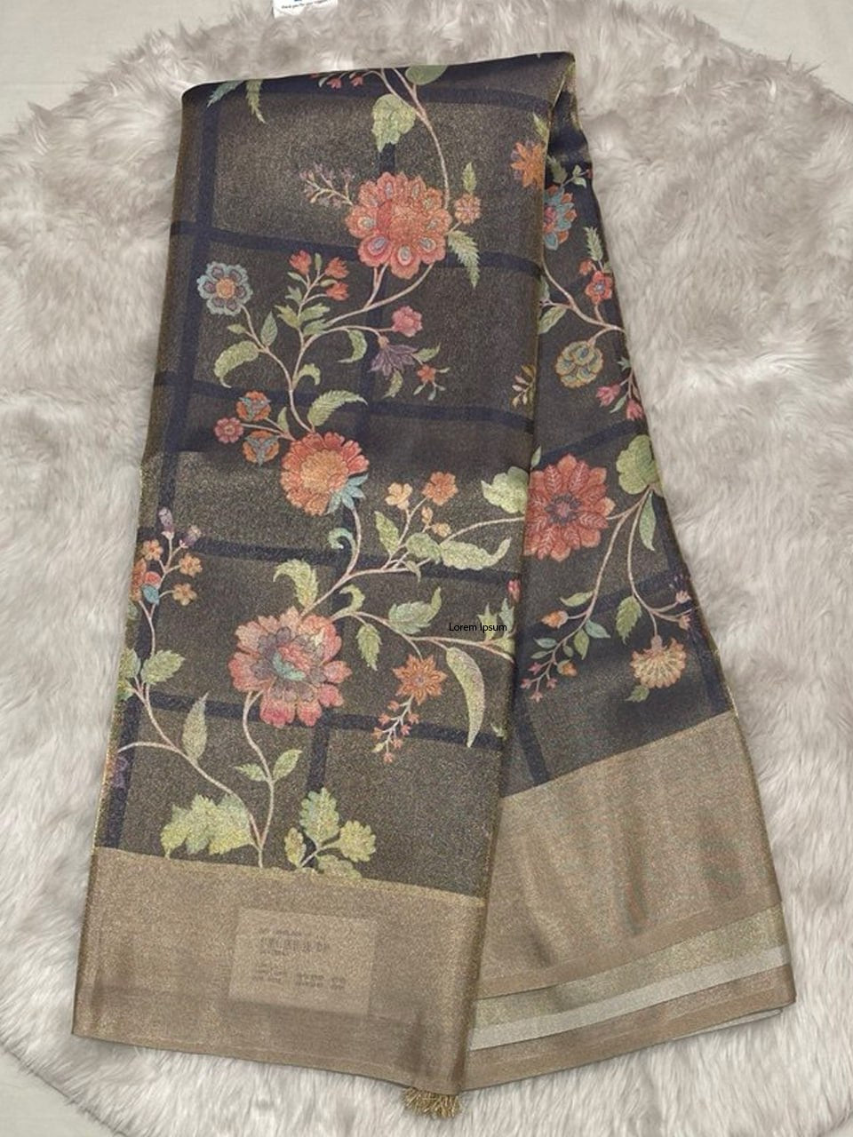 Rich chocolate brown Muslin Tissue saree with intricate floral digital printing and a metallic gold border.