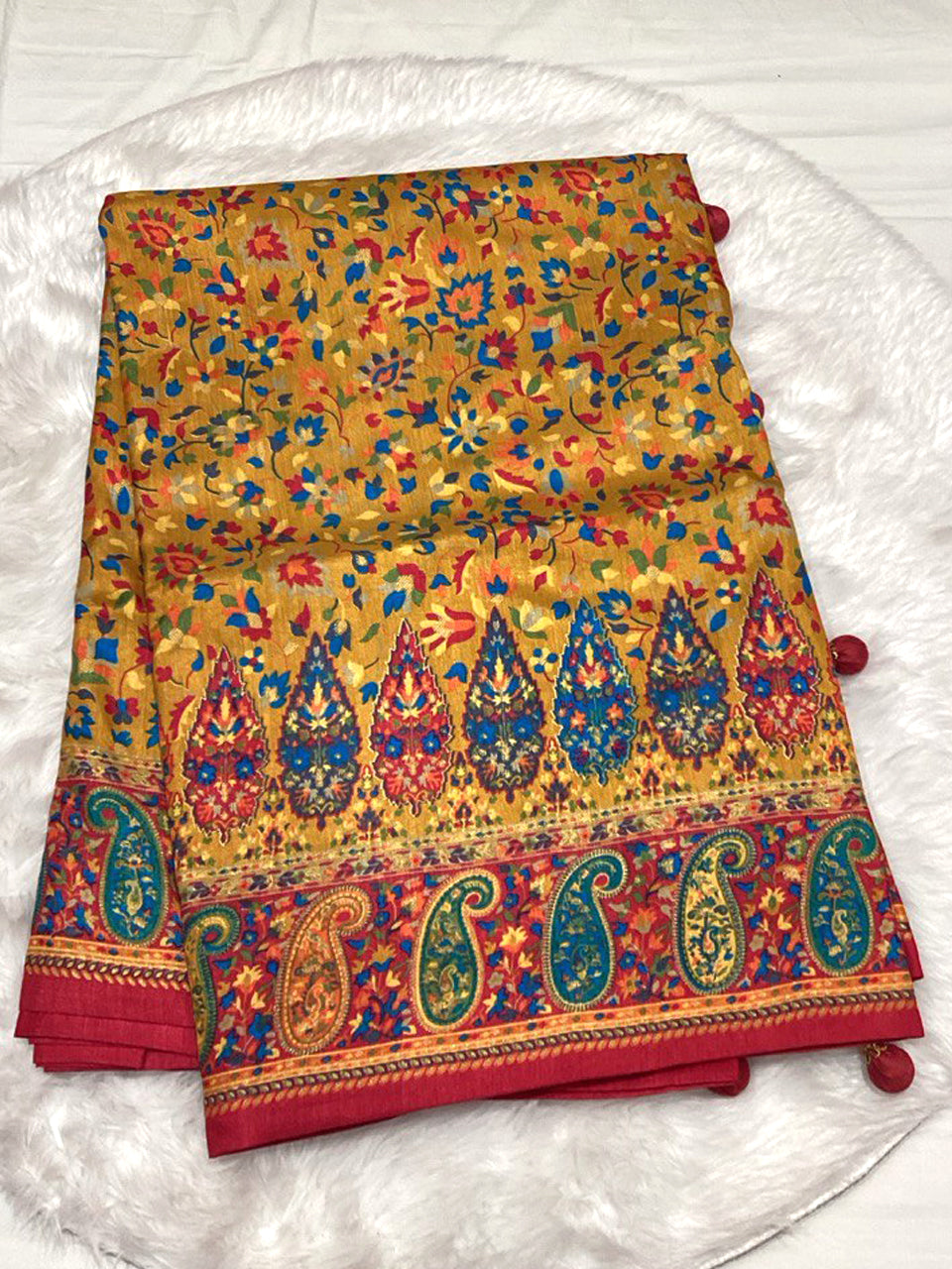 Mustard Yellow Dola Silk Saree with multicolored Patola print and red Zari border featuring paisley motifs.
