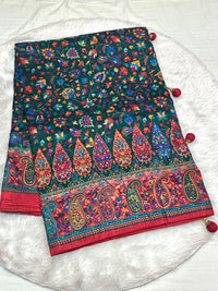Emerald Green Dola Silk Saree with vibrant Patola floral patterns and a red Zari border with decorative tassels.