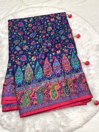Navy Blue Dola Silk Saree featuring traditional Patola artwork and a bright pink Zari border with corner tassels.