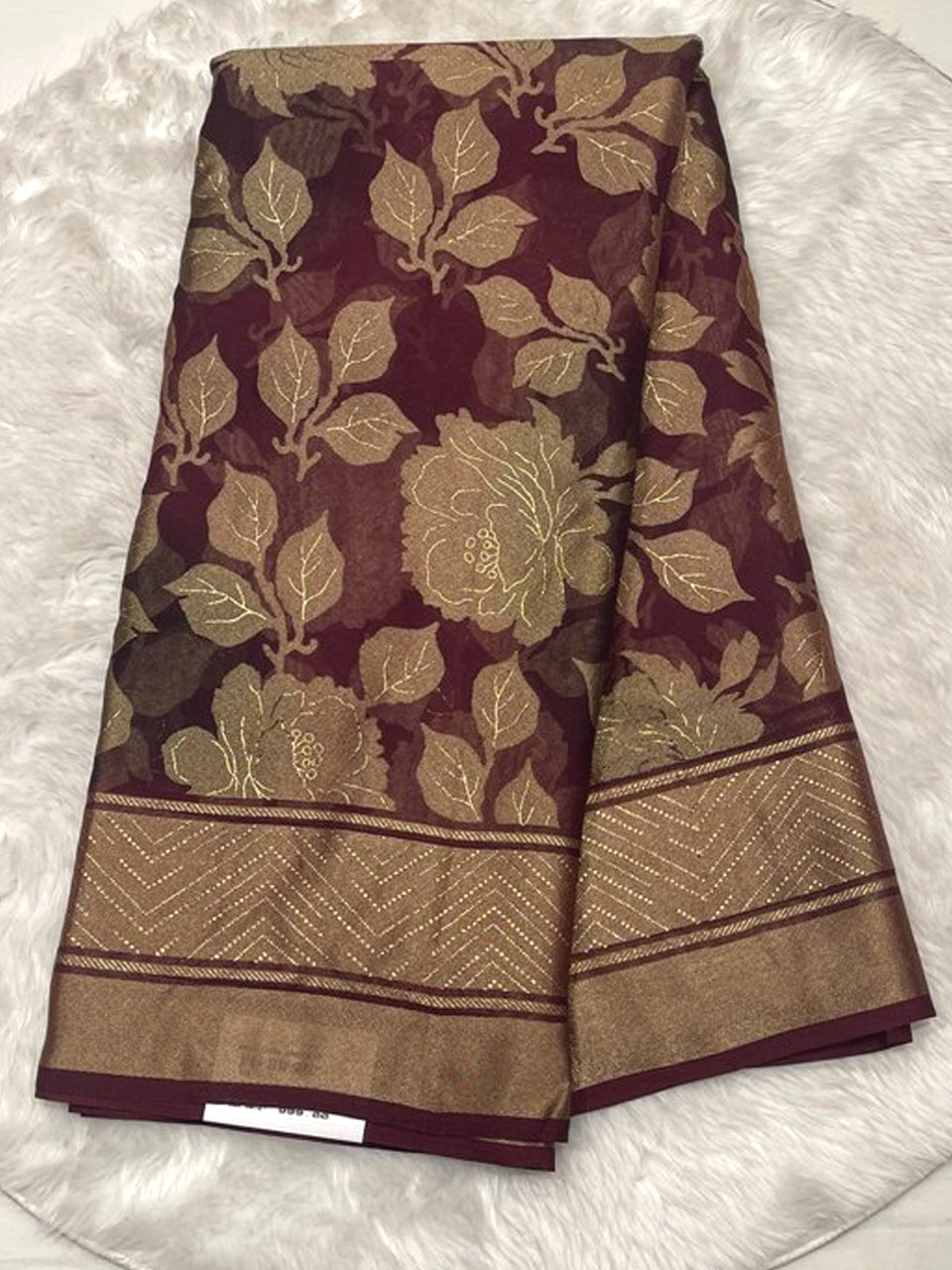 Deep wine Russian georgette braso saree with all-over floral velvet-touch textures and matching printed blouse.