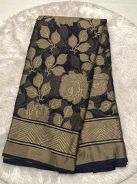 Sophisticated black Russian georgette braso saree featuring a glossy floral braso finish and printed blouse.