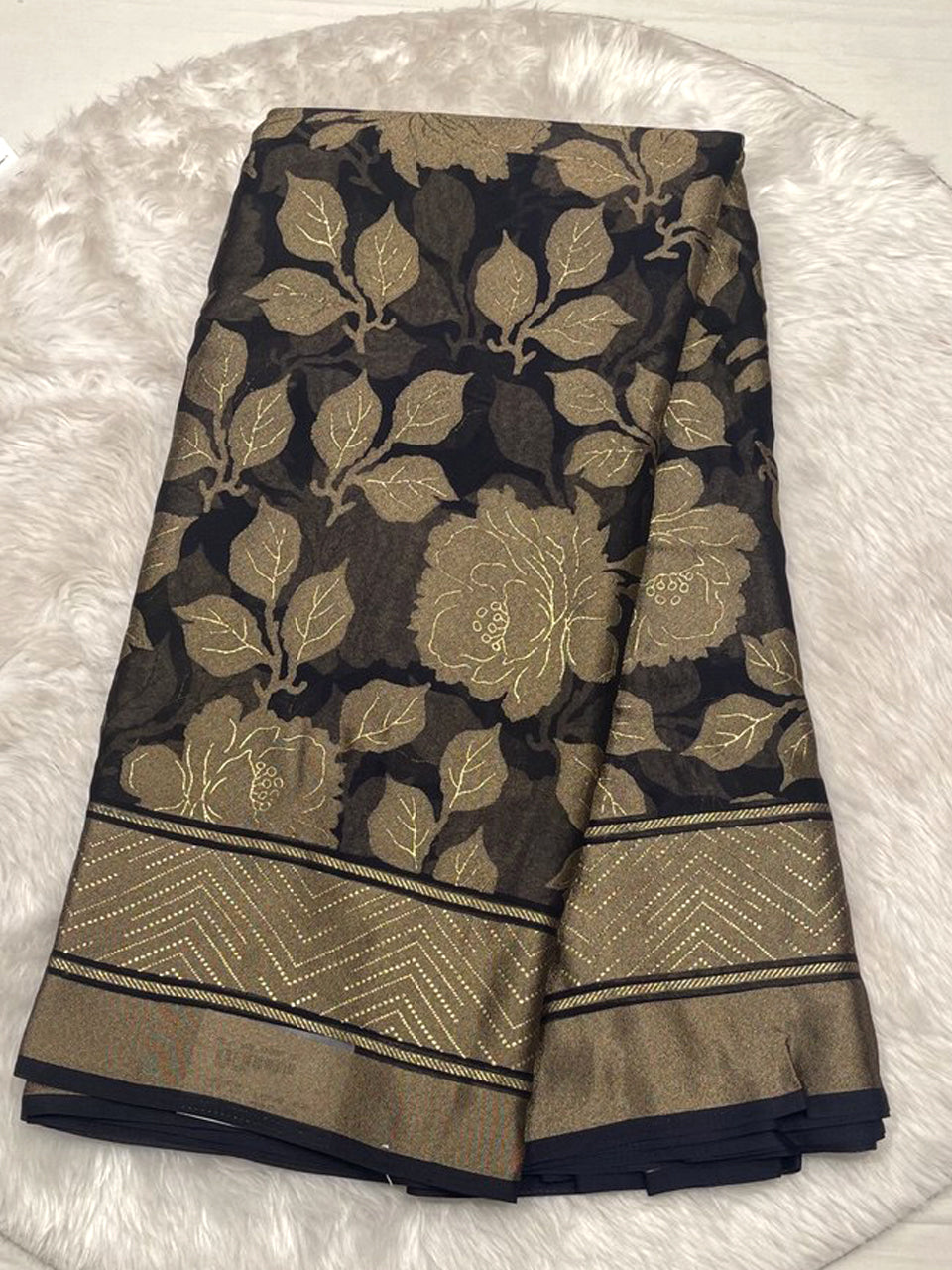 Sophisticated black Russian georgette braso saree featuring a glossy floral braso finish and printed blouse.
