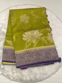Olive green Russian viscose saree featuring a purple paisley border and woven flower patterns.