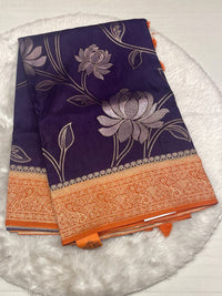 Deep plum purple Russian viscose silk saree with a contrasting bright orange zari border.
