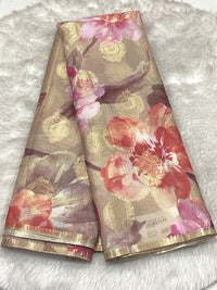 Beige Semi Silk Kota saree with peach and red floral prints, gold foil circular accents, and a thin gold border.