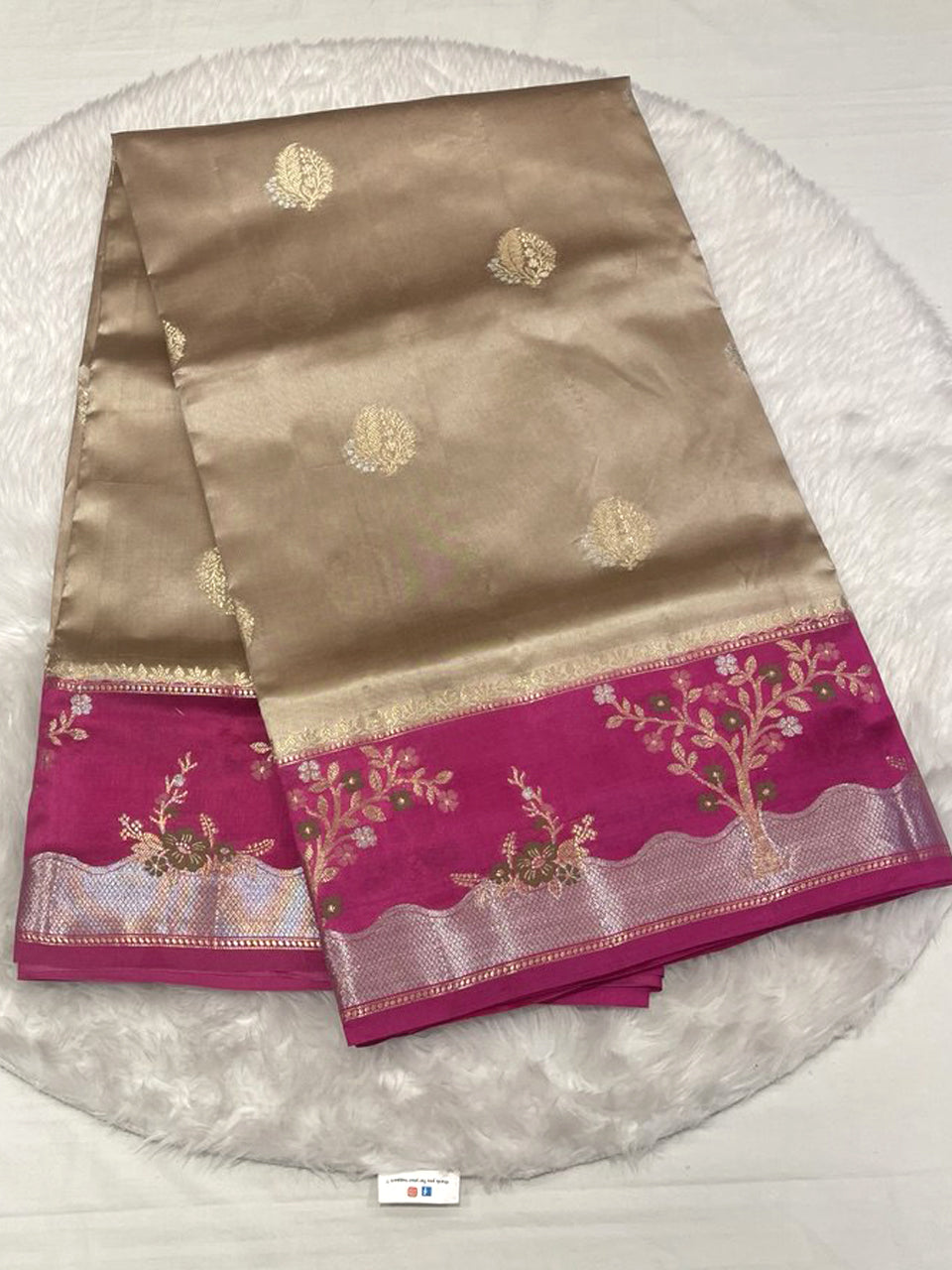 Elegant grey silk saree with plum purple contrast zari border and floral motifs.