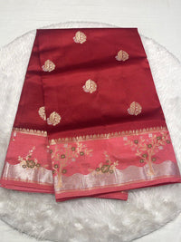Champagne gold silk saree with a striking magenta pink contrast border.
