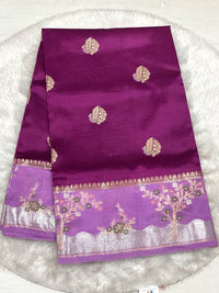 Rich magenta silk saree with a lavender purple border and tree embroidery.