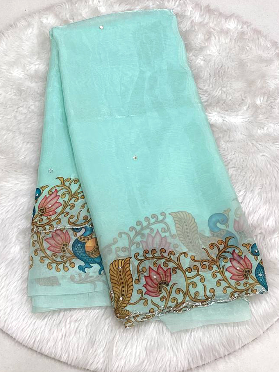 Seafoam aqua space silk saree featuring a multicolored designer cutwork border with peacock and lotus floral prints and small bead butas.