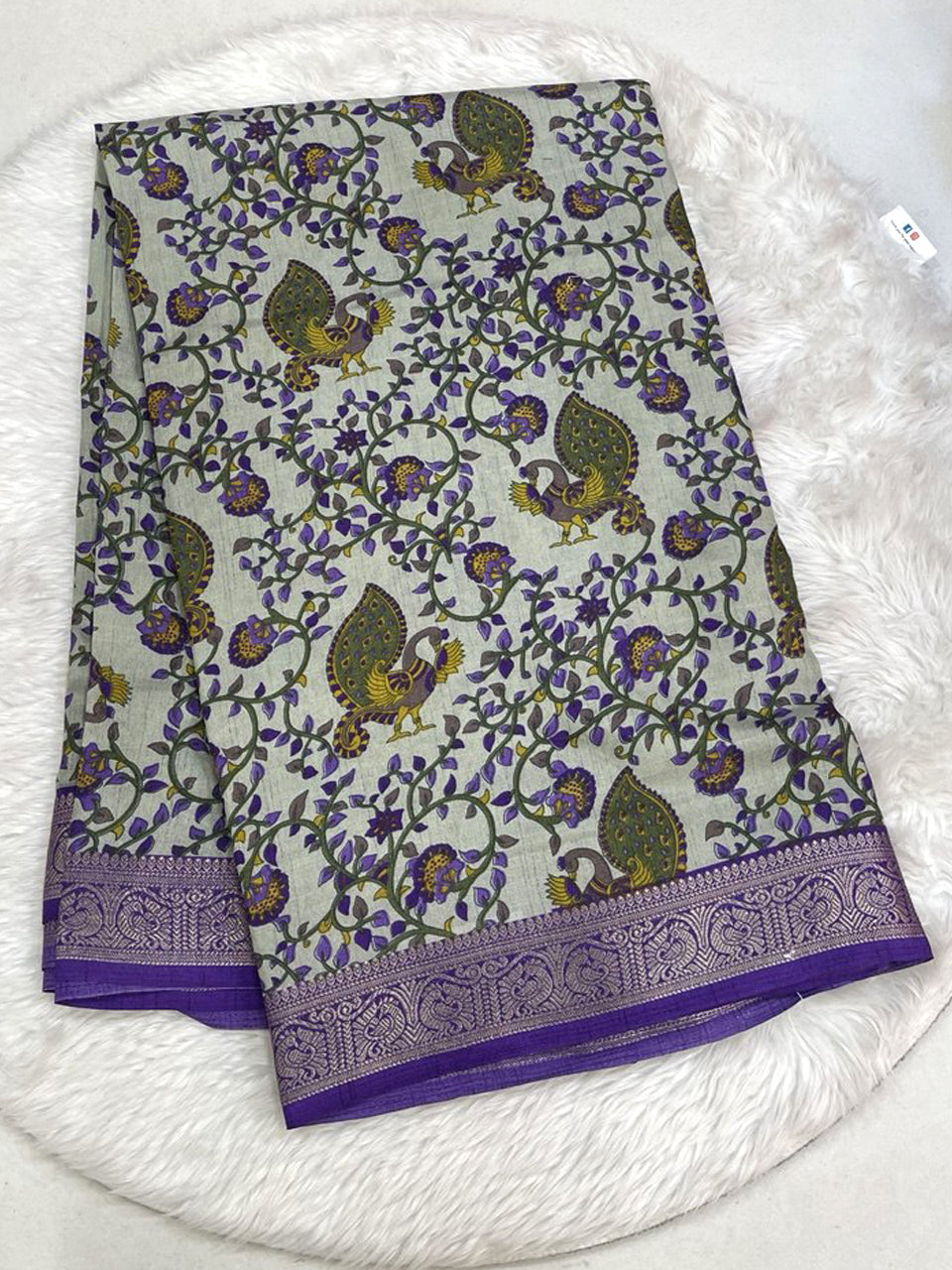 Light lime green Icon Silk saree featuring intricate all-over multi-work embroidery with pink bird motifs and a silver scalloped lace border.