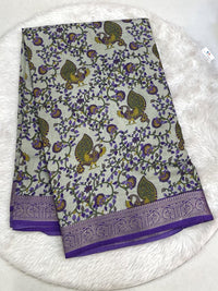 Light lime green Icon Silk saree featuring intricate all-over multi-work embroidery with pink bird motifs and a silver scalloped lace border.