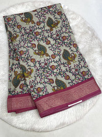 Deep royal blue Icon Silk saree with multi-color botanical embroidery and a contrast silver scalloped lace border.