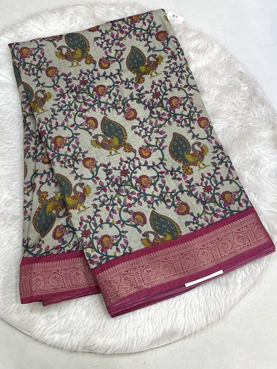 Deep royal blue Icon Silk saree with multi-color botanical embroidery and a contrast silver scalloped lace border.