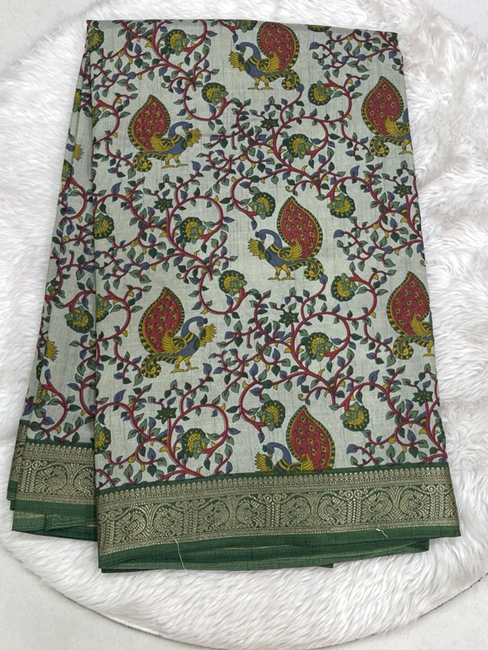 Elegant dark purple Icon Silk saree showcasing all-over multi-work bird and flower embroidery with a silver scalloped edge.