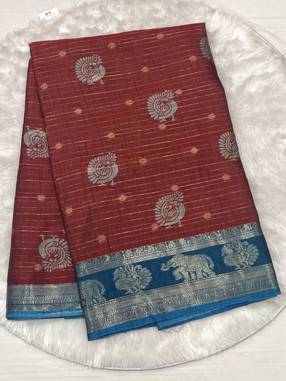 Maroon tussar soft silk saree with blue silver neem zari border.