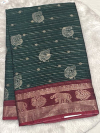 Bottle green tussar soft silk saree with maroon neem zari border.