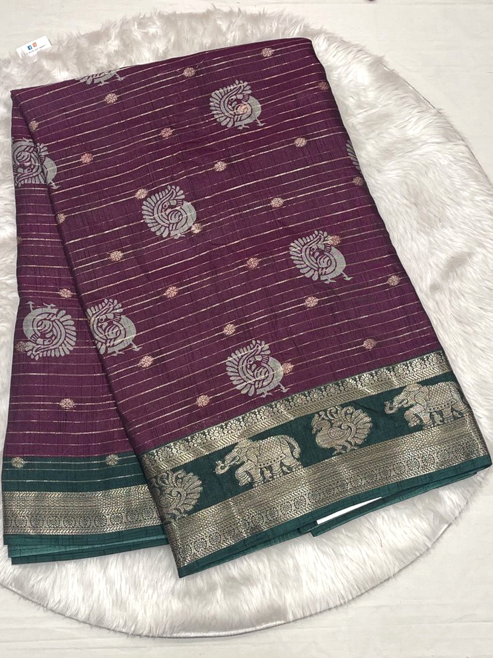 Purple tussar soft silk saree with green silver neem zari border.