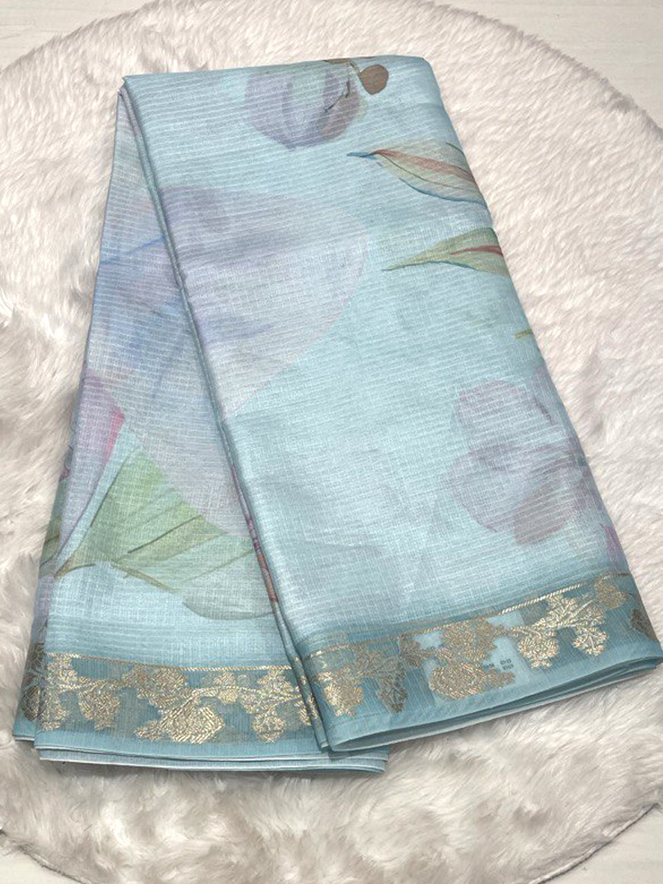 Sky blue Kota saree with abstract watercolor digital art and a shimmering woven Zari border
