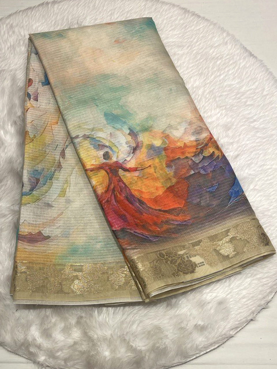 Cream-colored Zari Kota saree featuring a vibrant digital print of a dancing woman in a red dress and a gold floral Zari border.